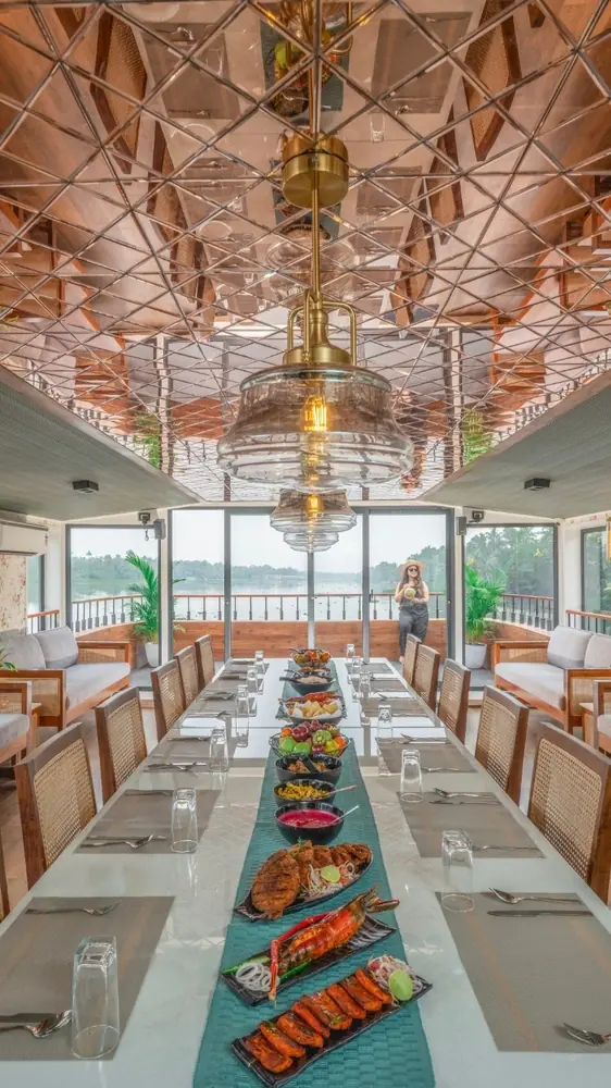Private group cruising with dining and gathering space on a Kerala houseboat